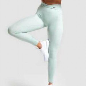 Gymshark light green poise cropped leggings with cross waist band